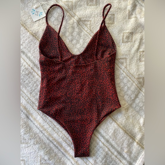 Cheeky one piece bikini! Size small fits like XS. Super cute, but did not fit me - Picture 2 of 3